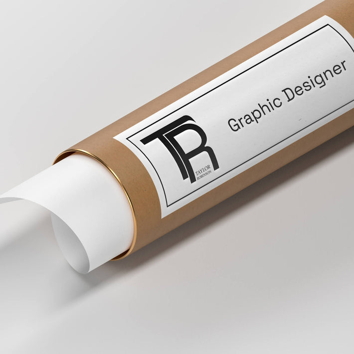 Close-up of a rolled tube with a label displaying the 'TR' monogram and the name 'Taylor Robinson,' with the title 'Graphic Designer' below.