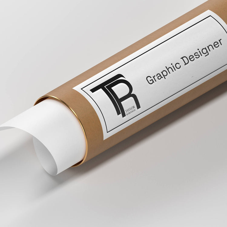 Close-up of a rolled tube with a label displaying the 'TR' monogram and the name 'Taylor Robinson,' with the title 'Graphic Designer' below.